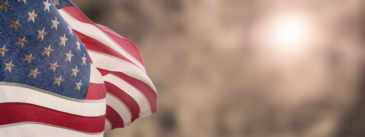 An American flag waving in the wind. An American flag waving in the wind.